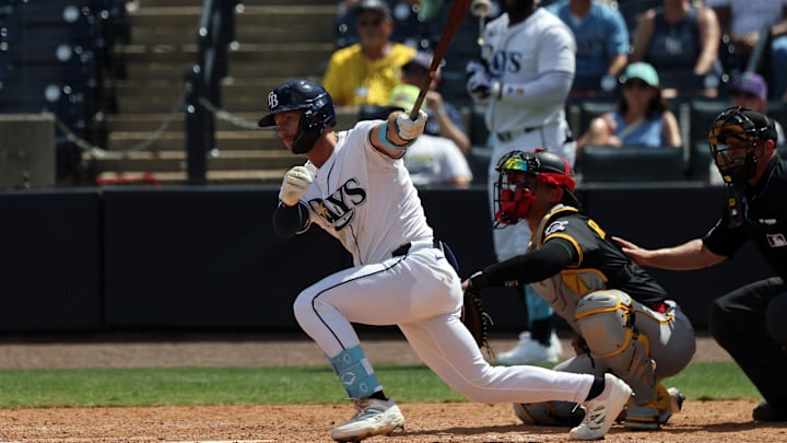 St. Petersburg, Florida, USA; Tampa Bay Rays outfielder Jonny DeLuca (21) hits a RBI single during the eighth inning against the Pittsburgh Pirates at George M. Steinbrenner Field.