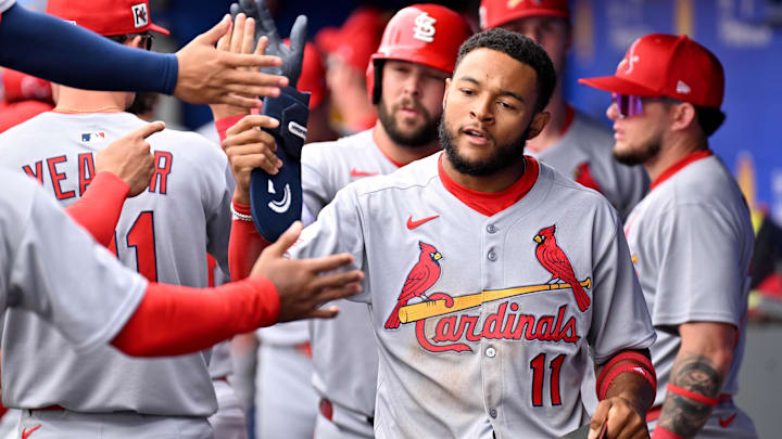 Feb 25, 2025; Dunedin, Florida, USA; St. Louis Cardinals left fielder Victor Scott II (11) celebrates after scoring a run against the Toronto Blue Jays in the first inning of a spring training game at TD Ballpark.