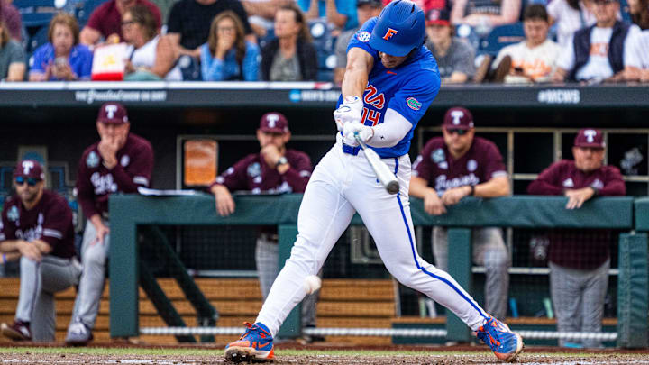 Florida Gators first baseman Jac Caglianone (14) hits a single against the Texas A&M Aggies during the third inning at Charles Schwab Field on June 19, 2024, during the College World Series in Omaha, Neb. Florida Gators first baseman Jac Caglianone (14) hits a single against the Texas A&M Aggies during the third inning at Charles Schwab Field on June 19, 2024, during the College World Series in Omaha, Neb.