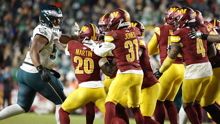 Dec 20, 2025; Landover, Maryland, USA; Philadelphia Eagles guard Tyler Steen (56) exchanges words the Washington Commanders during the second half at Northwest Stadium. Mandatory Credit: Amber Searls-Imagn Images