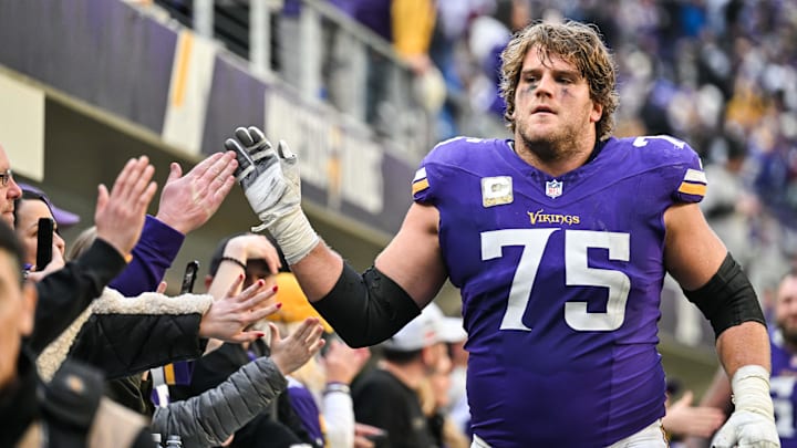 Dec 1, 2024; Minneapolis, Minnesota, USA; Minnesota Vikings offensive tackle Brian O'Neill (75) reacts with the crowd after the game against the Arizona Cardinals at U.S. Bank Stadium.