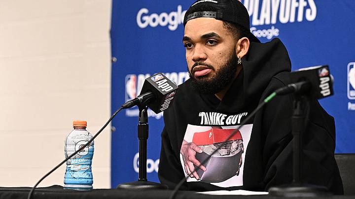 Karl-Anthony Towns with bottle of Gatorade on table during press conference Karl-Anthony Towns with bottle of Gatorade on table during press conference