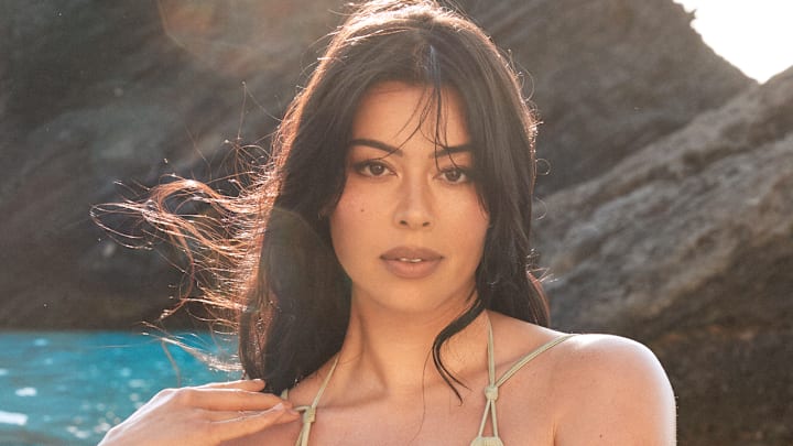 Lauren Chan was photographed by Ben Watts in Bermuda. Swimsuit by Cult Gaia. Bracelets by Alexis Bittar. Lauren Chan was photographed by Ben Watts in Bermuda. Swimsuit by Cult Gaia. Bracelets by Alexis Bittar.