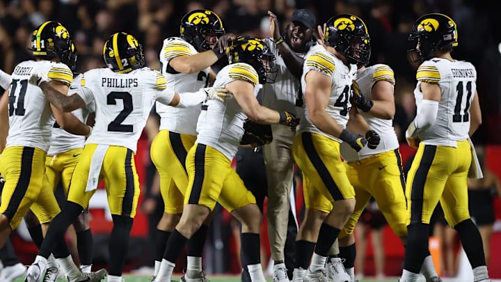 Iowa Hawkeyes defense celebrates an interception