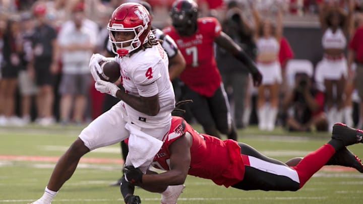Houston's wide receiver Samuel Brown (4) runs with the ball against Texas Tech, Saturday, Sept, 30, 2023, at Jones AT&T Stadium.