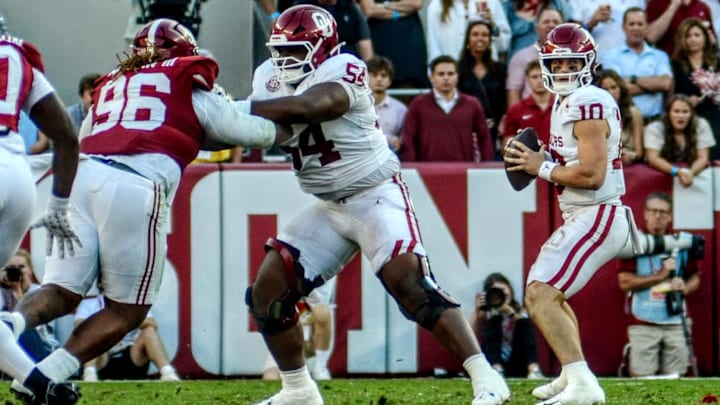 Oklahoma offensive lineman Febechi Nwaiwu protects quarterback John Mateer against Alabama. Oklahoma offensive lineman Febechi Nwaiwu protects quarterback John Mateer against Alabama.