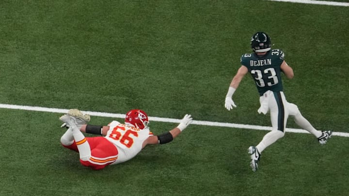 Feb 9, 2025; New Orleans, LA, USA; Philadelphia Eagles cornerback Cooper DeJean (33) intercepts a pass as Kansas City Chiefs guard Mike Caliendo (66) attempts to make the tackle in the second quarter during Super Bowl LIX at Caesars Superdome. Mandatory Credit: James Lang-Imagn Images