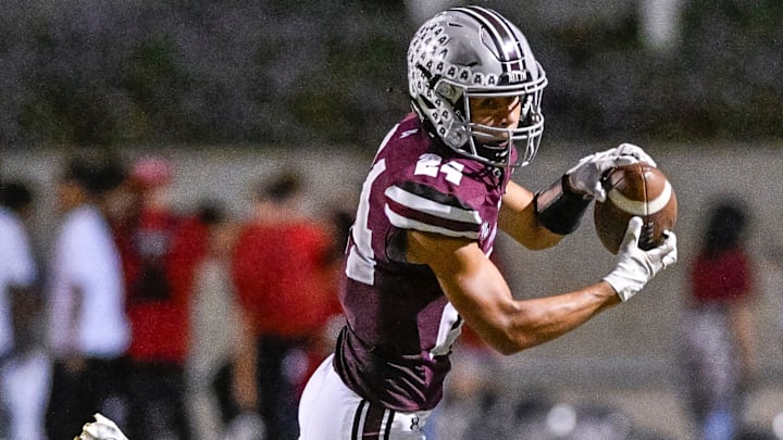 Mt. Whitney's Israel Briggs takes a pass against Mission Oak in non-league high school football on Friday, September 13, 2024.