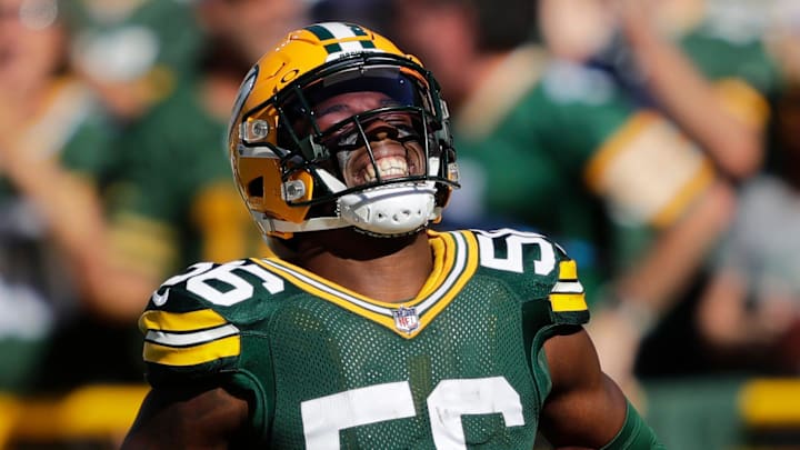 Green Bay Packers linebacker Edgerrin Cooper (56) celebrates recovering a fumble against the Minnesota Vikings during their football game Sunday, September 29, 2024, at Lambeau Field in Green Bay, Wisconsin.
