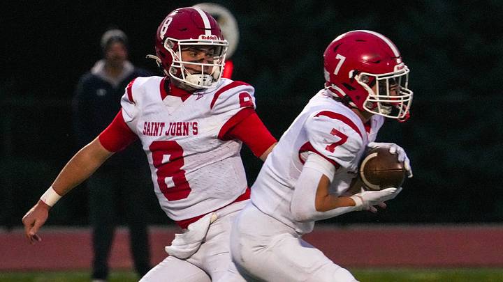 St. John’s quarterback Brad Perry hands off to running back Liam Deso against Shrewsbury Sept. 25 at Shrewsbury High School. St. John’s quarterback Brad Perry hands off to running back Liam Deso against Shrewsbury Sept. 25 at Shrewsbury High School.