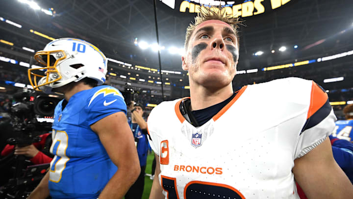Dec 19, 2024; Inglewood, California, USA; Los Angeles Chargers quarterback Justin Herbert (10) and Denver Broncos quarterback Bo Nix (10) embrace following the game at SoFi Stadium. 