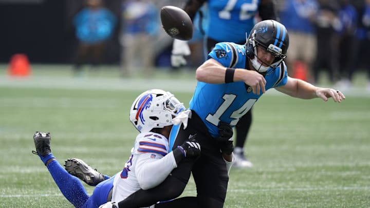 Oct 26, 2025; Charlotte, North Carolina, USA; Buffalo Bills defensive end Greg Rousseau (50) causes a fumble by Carolina Panthers quarterback Andy Dalton (14) during the first half at Bank of America Stadium. Oct 26, 2025; Charlotte, North Carolina, USA; Buffalo Bills defensive end Greg Rousseau (50) causes a fumble by Carolina Panthers quarterback Andy Dalton (14) during the first half at Bank of America Stadium.