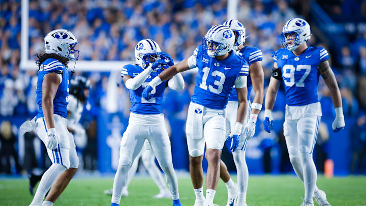 BYU defensive end Tausili Akana celebrates a tackle for loss against TCU