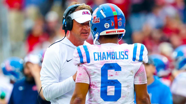 Oct 25, 2025; Norman, Oklahoma, USA;  Ole Miss Rebels head coach Lane Kiffin speaks with Ole Miss Rebels quarterback Trinidad Chambliss (6) during the second half at Gaylord Family-Oklahoma Memorial Stadium. Mandatory Credit: Kevin Jairaj-Imagn Images