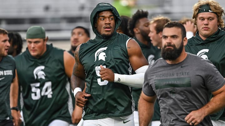 Michigan State's Jordan Hall, center, and the rest of the Spartans head back to the locker room before the game against Florida Atlantic on Friday, Aug. 30, 2024, at Spartan Stadium in East Lansing.