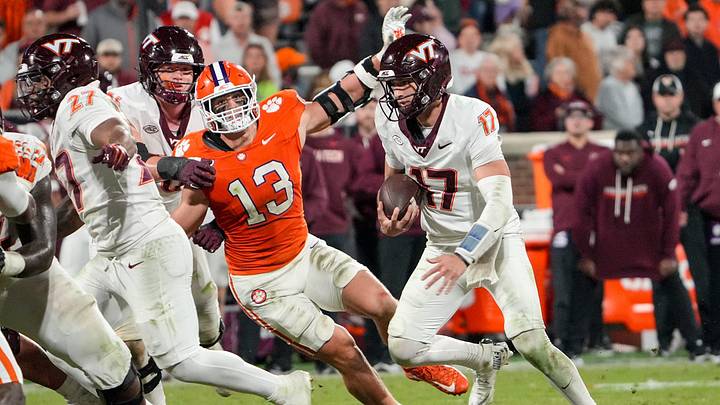 Clemson defensive end Will Heldt (13) pressures Virginia Tech Hokies quarterback Ethan Grunkemeyer (17) during the fourth quarter at Memorial Stadium Saturday, October 24, 2026. Clemson defensive end Will Heldt (13) pressures Virginia Tech Hokies quarterback Ethan Grunkemeyer (17) during the fourth quarter at Memorial Stadium Saturday, October 24, 2026.