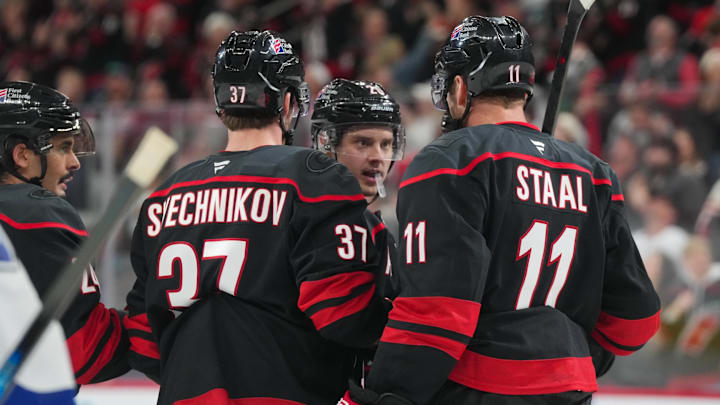 Feb 26, 2026; Raleigh, North Carolina, USA; Carolina Hurricanes center Sebastian Aho (20) celebrates his goal with right wing Andrei Svechnikov (37) and center Jordan Staal (11) against the Tampa Bay Lightning during the third period at Lenovo Center. Mandatory Credit: James Guillory-Imagn Images Feb 26, 2026; Raleigh, North Carolina, USA; Carolina Hurricanes center Sebastian Aho (20) celebrates his goal with right wing Andrei Svechnikov (37) and center Jordan Staal (11) against the Tampa Bay Lightning during the third period at Lenovo Center. Mandatory Credit: James Guillory-Imagn Images