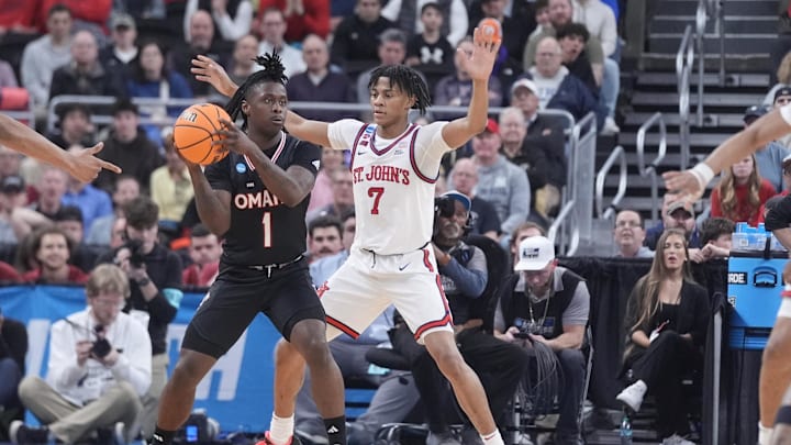 Mar 20, 2025; Providence, RI, USA;  Omaha Mavericks guard JJ White (1) controls the ball against St. John's basketball guard Simeon Wilcher (7) during the first half at Amica Mutual Pavilion.