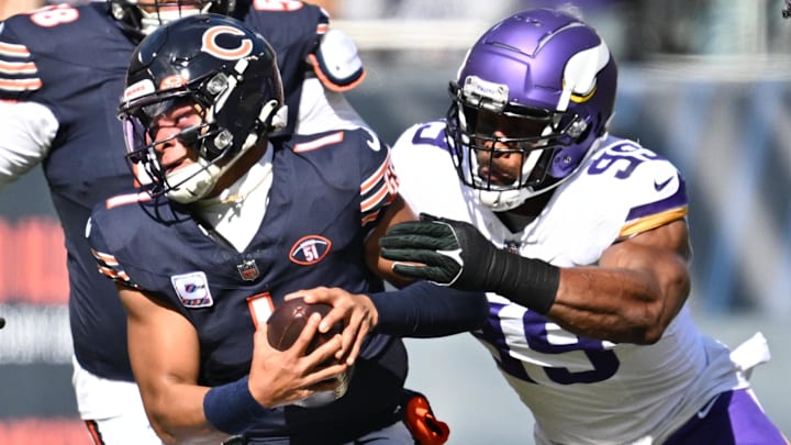 Oct 15, 2023; Chicago, Illinois, USA;  Chicago Bears quarterback Justin Fields (1) is chased out of