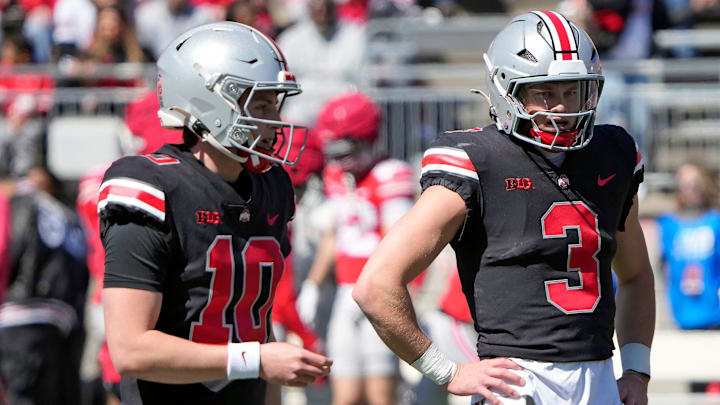 Ohio State Buckeye quarterbacks Julian Sayin (10) and Lincoln Kienholz (3) warm up before the start of the spring game at Ohio Stadium on April 12, 2025.