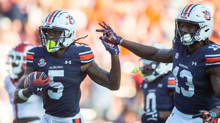 Auburn Tigers wide receiver KeAndre Lambert-Smith (5) and tight end Rivaldo Fairweather (13) celebrate Lambert-Smith’s touchdown as Auburn Tigers take on Arkansas Razorbacks at Jordan-Hare Stadium in Auburn, Ala., on Saturday, Sept. 21, 2024. Arkansas Razorbacks defeated Auburn Tigers 24-14.
