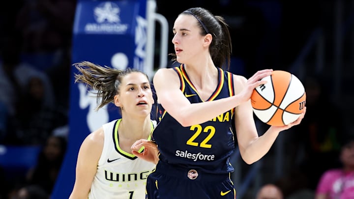 May 3, 2024; Dallas, Texas, USA; Indiana Fever guard Caitlin Clark (22) controls the ball as Dallas Wings guard Ashley Joens (1) defends during the second half at College Park Center. Mandatory Credit: Kevin Jairaj-Imagn Images May 3, 2024; Dallas, Texas, USA; Indiana Fever guard Caitlin Clark (22) controls the ball as Dallas Wings guard Ashley Joens (1) defends during the second half at College Park Center. Mandatory Credit: Kevin Jairaj-Imagn Images
