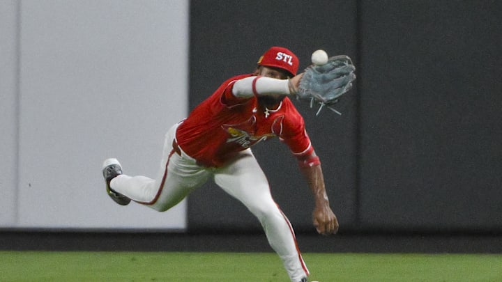Aug 15, 2025; St. Louis, Missouri, USA; St. Louis Cardinals center fielder Victor Scott II (11) dives and catches a line drive hit by New York Yankees shortstop Anthony Volpe (not pictured) during the eighth inning at Busch Stadium. Mandatory Credit: Jeff Curry-Imagn Images Aug 15, 2025; St. Louis, Missouri, USA; St. Louis Cardinals center fielder Victor Scott II (11) dives and catches a line drive hit by New York Yankees shortstop Anthony Volpe (not pictured) during the eighth inning at Busch Stadium. Mandatory Credit: Jeff Curry-Imagn Images
