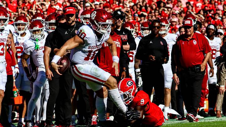 Oklahoma quarterback John Mateer gets tackled against Georgia. Oklahoma quarterback John Mateer gets tackled against Georgia.