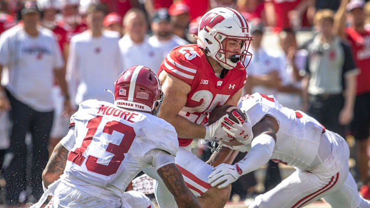 Wisconsin Cade Yacamelli (25) attempts to break through a defense during the game against Alabama at Camp Randall Stadium in Madison, Wis. on Saturday, September 14, 2024.