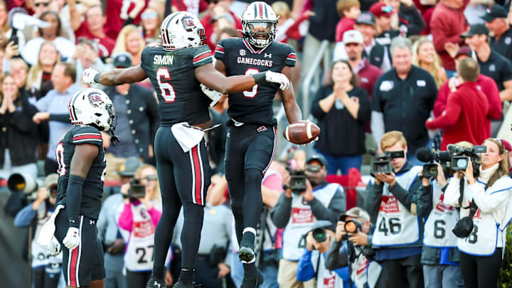 Nov 16, 2024; Columbia, South Carolina, USA; South Carolina Gamecocks wide receiver Nyck Harbor (8) celebrates a 26-yard touchdown reception with tight end Joshua Simon (6) against the Missouri Tigers in the first quarter at Williams-Brice Stadium. Mandatory Credit: Jeff Blake-Imagn Images