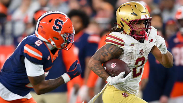 Nov 29, 2025; Syracuse, New York, USA; Boston College Eagles running back Turbo Richard (2) runs against Syracuse Orange defensive back Duce Chestnut (2) during the second half at the JMA Wireless Dome. Mandatory Credit: Rich Barnes-Imagn Images Nov 29, 2025; Syracuse, New York, USA; Boston College Eagles running back Turbo Richard (2) runs against Syracuse Orange defensive back Duce Chestnut (2) during the second half at the JMA Wireless Dome. Mandatory Credit: Rich Barnes-Imagn Images