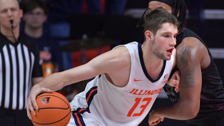 Nov 23, 2024; Champaign, Illinois, USA;  Illinois Fighting Illini center Tomislav Ivisic (13) drives the ball against Maryland-Eastern Shore Hawks forward Christopher Flippin (35) during the second half at State Farm Center. Mandatory Credit: Ron Johnson-Imagn Images