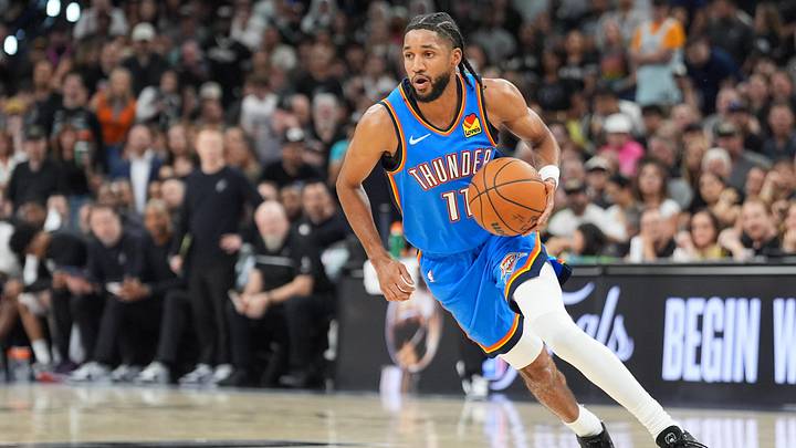 May 24, 2026; San Antonio, Texas, USA; Oklahoma City Thunder guard Isaiah Joe (11) moves the ball in the fourth quarter against the San Antonio Spurs during game four of the Western Conference Finals for the 2026 NBA playoffs at Frost Bank Center. 
