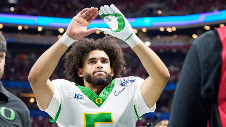 Oregon quarterback Dante Moore walks off the field as the Oregon Ducks face the Indiana Hoosiers in the Peach Bowl on Jan. 9, 2026, at Mercedes-Benz Stadium in Atlanta, Georgia.