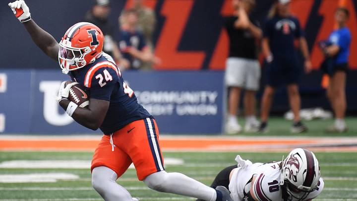 Sep 19, 2026; Champaign, Illinois, USA; Illinois Fighting Illini running back Javari Barnett (24) slips the tackle of Southern Illinois Salukis linebacker Cole Lalama (10) during the second half at Gies Memorial Stadium. Mandatory Credit: Ron Johnson-Imagn Images Sep 19, 2026; Champaign, Illinois, USA; Illinois Fighting Illini running back Javari Barnett (24) slips the tackle of Southern Illinois Salukis linebacker Cole Lalama (10) during the second half at Gies Memorial Stadium. Mandatory Credit: Ron Johnson-Imagn Images