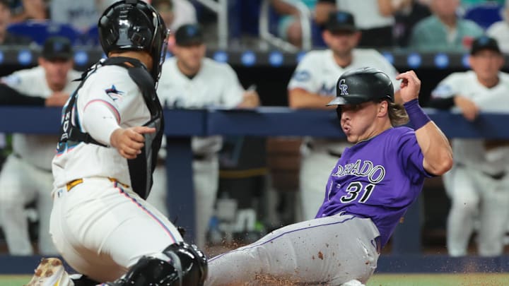 Mar 27, 2026; Miami, Florida, USA; Colorado Rockies left fielder Jake McCarthy (31) is tagged out at home plate by Miami Marlins catcher Agustin Ramirez (50) during the fourth inning at loanDepot Park. Mandatory Credit: Sam Navarro-Imagn Images Mar 27, 2026; Miami, Florida, USA; Colorado Rockies left fielder Jake McCarthy (31) is tagged out at home plate by Miami Marlins catcher Agustin Ramirez (50) during the fourth inning at loanDepot Park. Mandatory Credit: Sam Navarro-Imagn Images