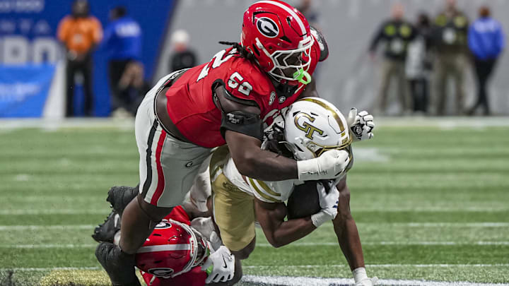 Georgia Christen Miller (52) and safety Zion Branch get the tackle. Miller's run-stopping ability makes him an ideal Bears pick if the top two or three defensive tackls in the draft are gone. 