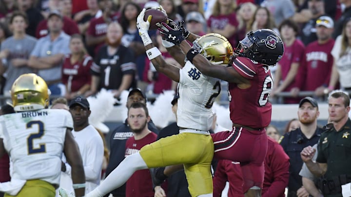 Notre Dame cornerback Benjamin Morrison intercepts a pass intended for South Carolina Gamecocks wide receiver O'Mega Blake.