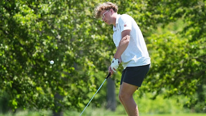 Gilbert’s Owen Wilcox chips the ball from rough in the Raccoon River Conference! Boys golf at Veenker Golf Course, in Ames, Iowa.