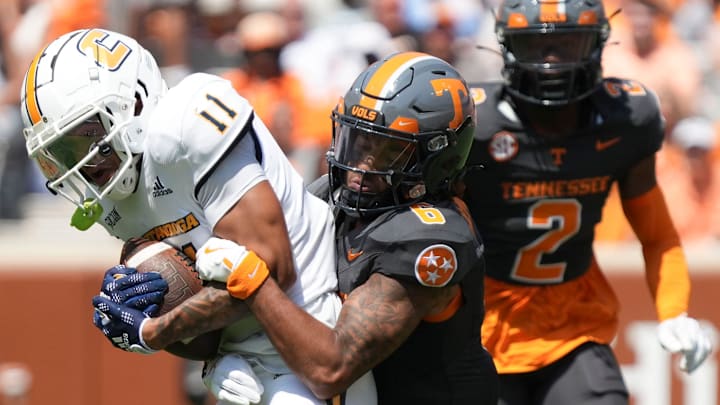 Chattanooga wide receiver Sam Phillips (11) tackled by Tennessee defensive back Jalen McMurray (6) during a game between Tennessee and Chattanooga, Saturday, Aug. 31, 2024.