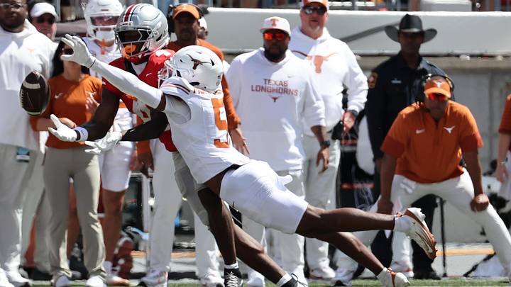Aug 30, 2025; Columbus, Ohio, USA; Ohio State Buckeyes wide receiver Jeremiah Smith (4) makes a catch over Texas Longhorns defensive back Malik Muhammad (5) in the first half at Ohio Stadium. Mandatory Credit: Joseph Maiorana-Imagn Images Aug 30, 2025; Columbus, Ohio, USA; Ohio State Buckeyes wide receiver Jeremiah Smith (4) makes a catch over Texas Longhorns defensive back Malik Muhammad (5) in the first half at Ohio Stadium. Mandatory Credit: Joseph Maiorana-Imagn Images