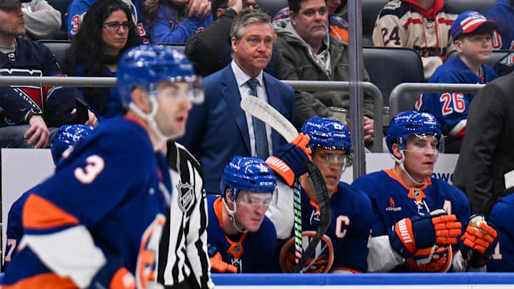 Apr 10, 2025; Elmont, New York, USA;  New York Islanders head coach Patrick Roy watches as the New York Rangers are beating the New York Islanders 3-0 during the first period at UBS Arena. Mandatory Credit: Dennis Schneidler-Imagn Images