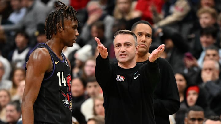 Jan 21, 2025; Toronto, Ontario, CAN;  Toronto Raptors head coach Darko Rajakovic speaks with guard Ja'Kobe Walter (14) as assistant coach Jama Mahlalela looks on in the second half against the Orlando Magic at Scotiabank Arena. Mandatory Credit: Dan Hamilton-Imagn Images