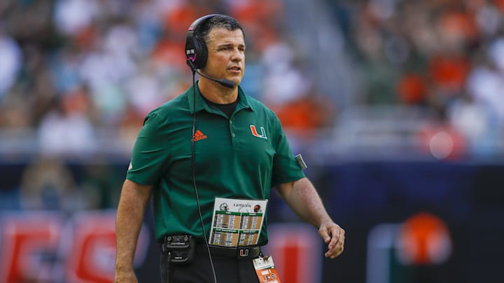 Sep 3, 2022; Miami Gardens, Florida, USA; Miami Hurricanes head coach Mario Cristobal watches from the sideline during the second quarter against the Bethune Cookman Wildcats at Hard Rock Stadium. Mandatory Credit: Sam Navarro-Imagn Images