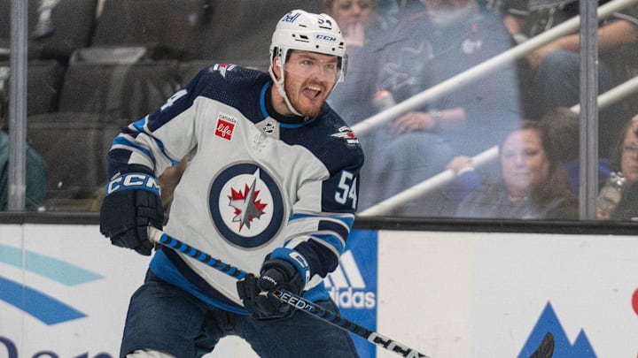 Jan 4, 2024; San Jose, California, USA; Winnipeg Jets defenseman Dylan Samberg (54) reacts during