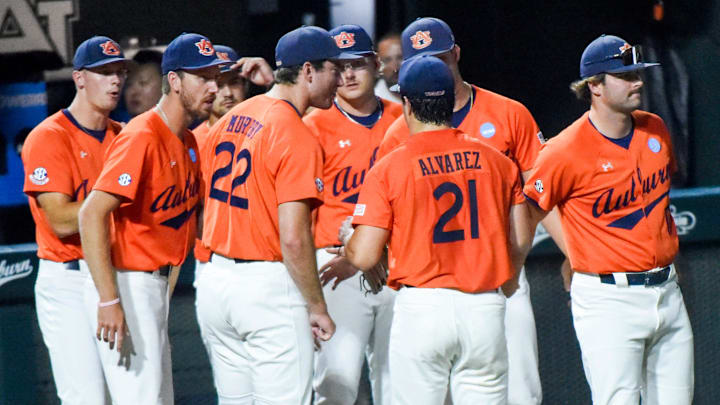 Auburn Tigers' Andreas Alvarez (21) is greeted at the dugout after closing out an inning against the NC State Wolfpack during the NCAA Regional Baseball Tournament at Plainsman Park in Auburn, Ala., on Sunday June 1, 2025.