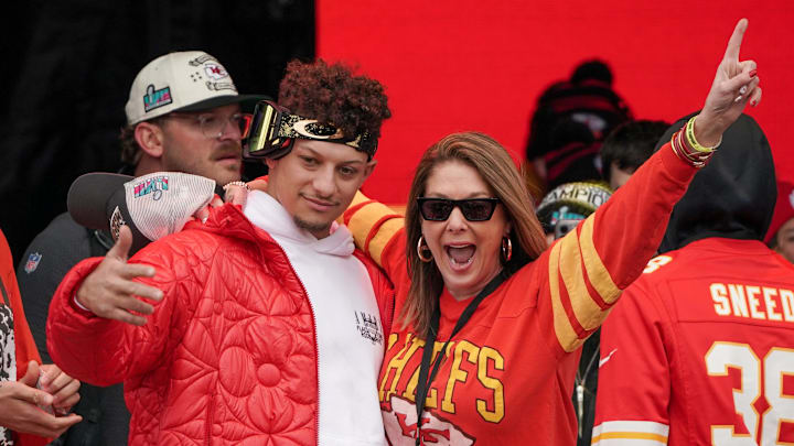 Feb 15, 2023; Kansas City, Missouri, USA; Kansas City Chiefs quarterback Patrick Mahomes (15) celebrates with his mother Randi Martin during the Kansas City Chiefs Super Bowl parade. Mandatory Credit: Denny Medley-USA TODAY Sports