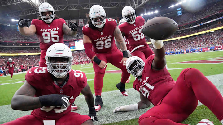 Arizona Cardinals defensive end L.J. Collier (91) celebrates his fumble recovery with teammates against the Los Angeles Rams during the fourth quarter at State Farm Stadium in Glendale on Sept. 15, 2024.