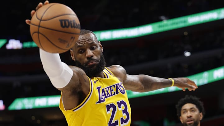 Nov 29, 2023; Detroit, Michigan, USA;  Los Angeles Lakers forward LeBron James (23) grabs a rebound in the second half against the Detroit Pistons at Little Caesars Arena. Mandatory Credit: Rick Osentoski-Imagn Images