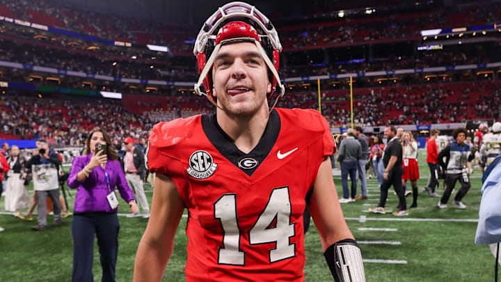 Nov 28, 2025; Atlanta, Georgia, USA; Georgia Bulldogs quarterback Gunner Stockton (14) celebrates after a victory over the Georgia Tech Yellow Jackets at Mercedes-Benz Stadium. Mandatory Credit: Brett Davis-Imagn Images
Nov 28, 2025; Atlanta, Georgia, USA; Georgia Bulldogs quarterback Gunner Stockton (14) celebrates after a victory over the Georgia Tech Yellow Jackets at Mercedes-Benz Stadium. Mandatory Credit: Brett Davis-Imagn Images